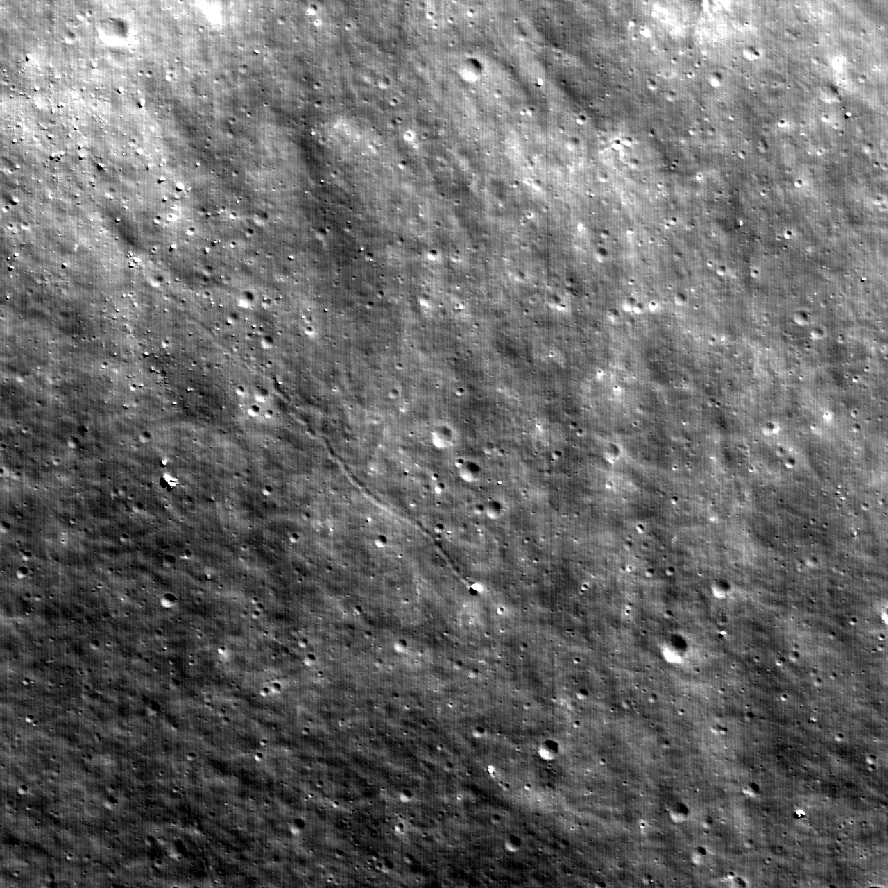 LROC image from 2010 showing a sinuous boulder track ending at a bright block